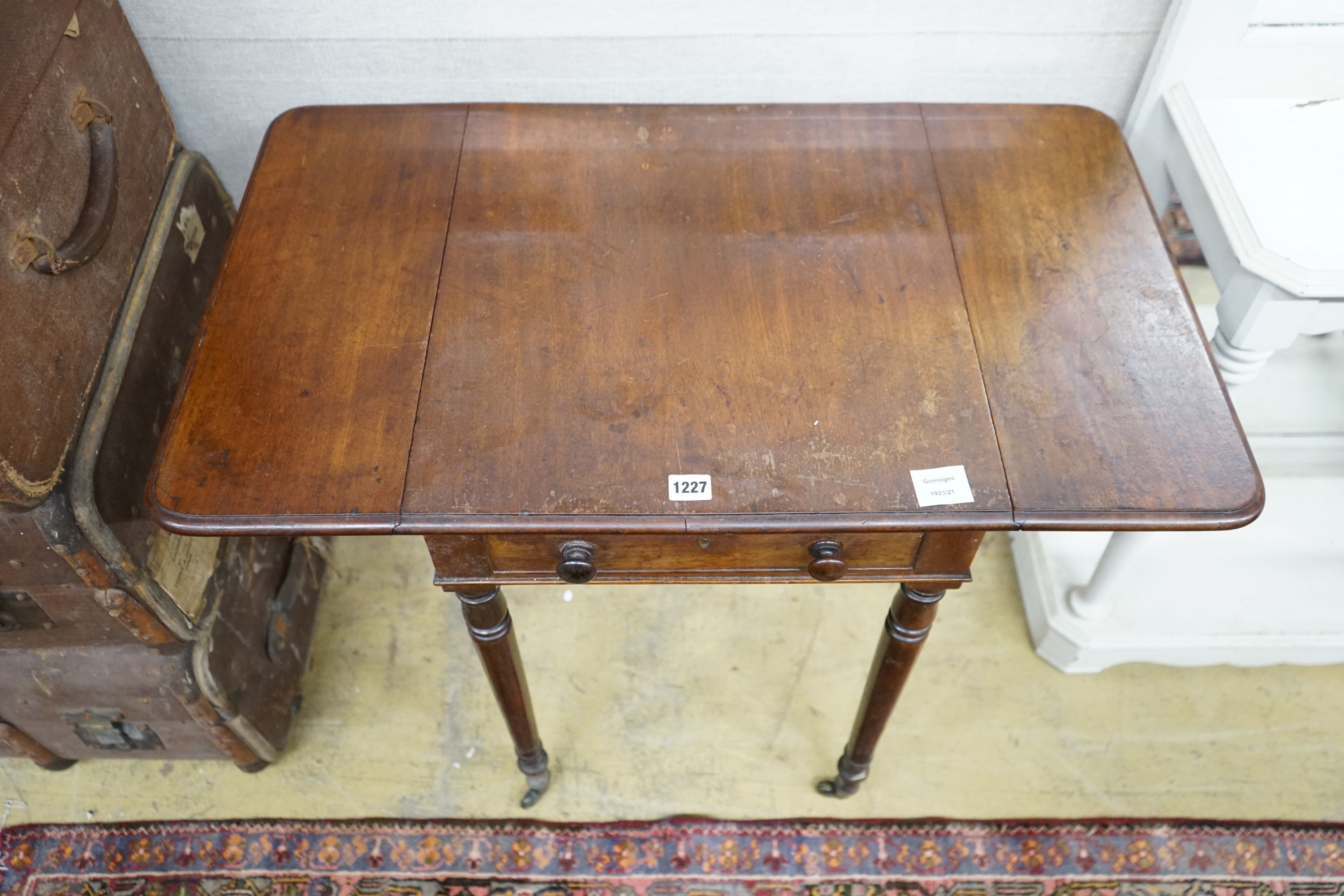 A Regency mahogany drop flap work table, width 84cm extended, depth 50cm, height 71cm